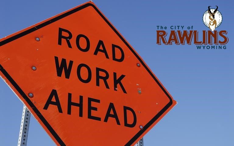 Construction road sign against a blue sky
